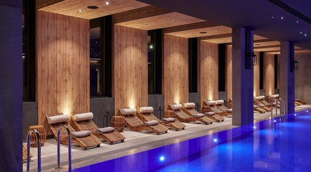 Luxurious relaxation area at Vassa Spa BOR Hotel by Karisma, Zlatibor, RS with poolside seating and ambient lighting.