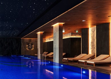 Luxurious indoor pool at Vassa Spa BOR Hotel by Karisma, Zlatibor, RS, with ambient lighting and starry ceiling.