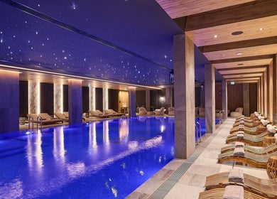 Luxurious indoor pool at Vassa Spa BOR Hotel by Karisma, Zlatibor, RS, with starlit ceiling and plush loungers.