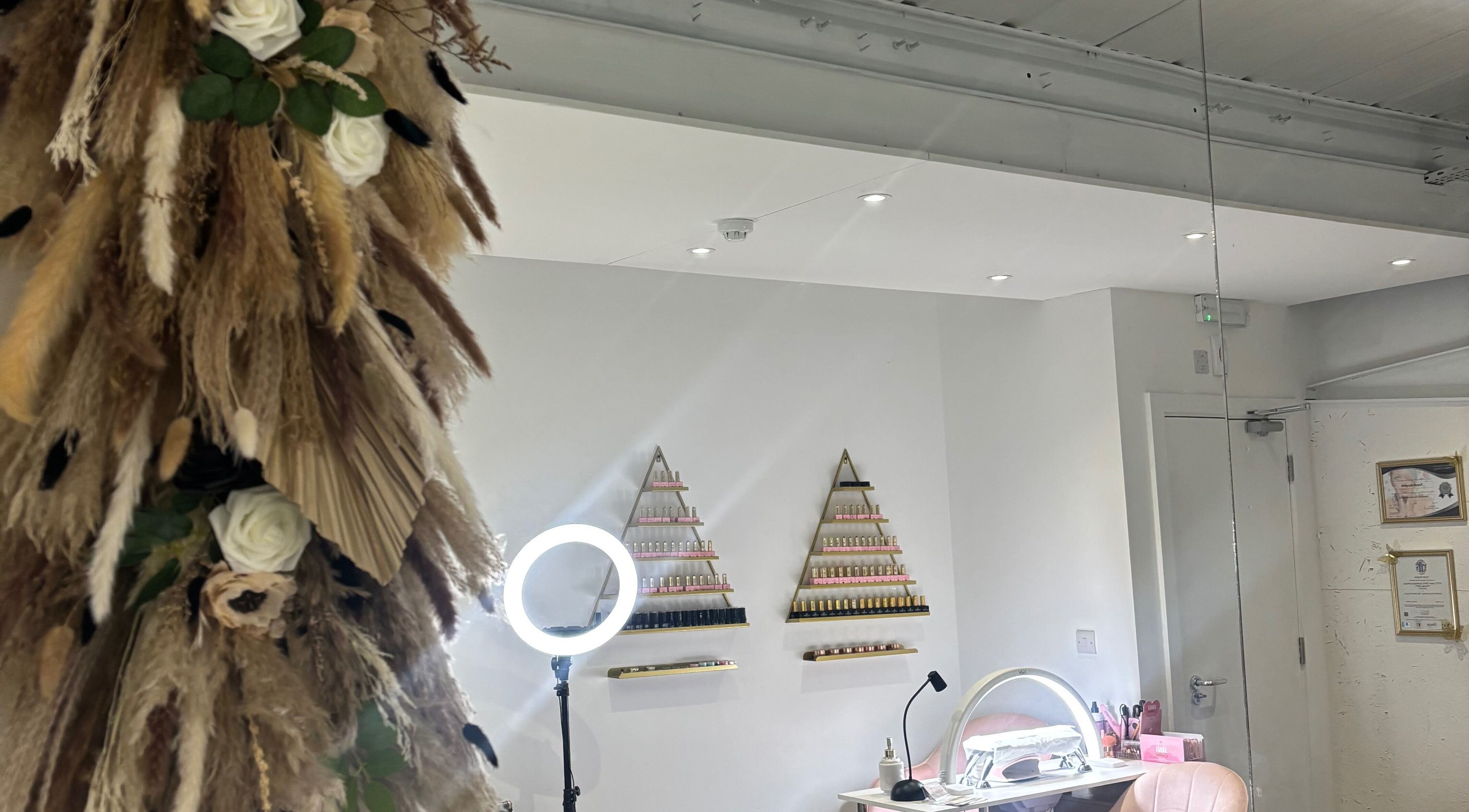 Chic interior of B’s Beauty Hive, Cardiff, Wales, GB with stylish decor and nail polish displays.