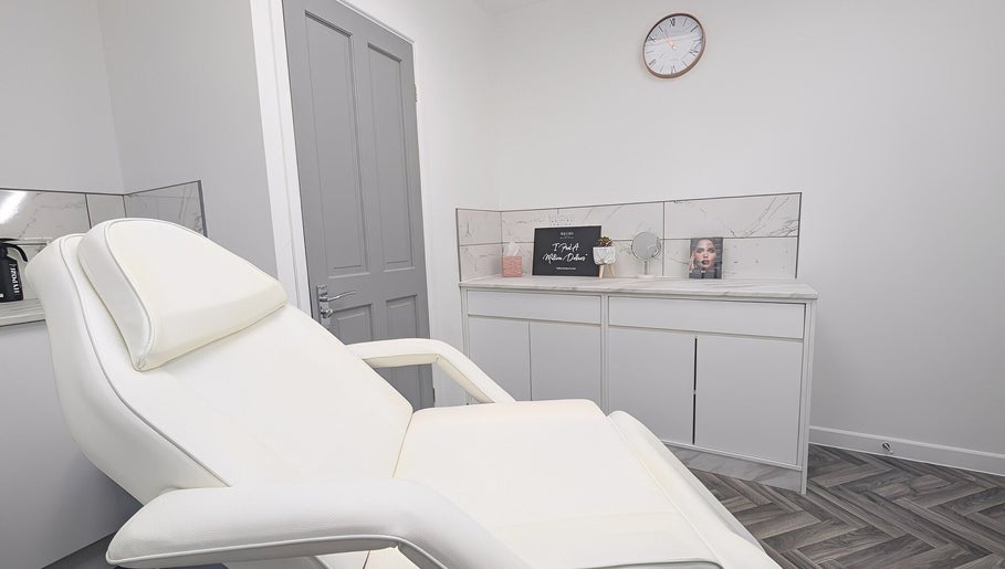 Elegant treatment room at New Age Aesthetics, Doncaster, England, GB, featuring a modern white chair.