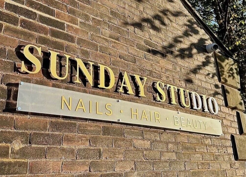 Exterior sign of Sunday Studio showcasing nails, hair, beauty in Horbury, Wakefield, England, GB.