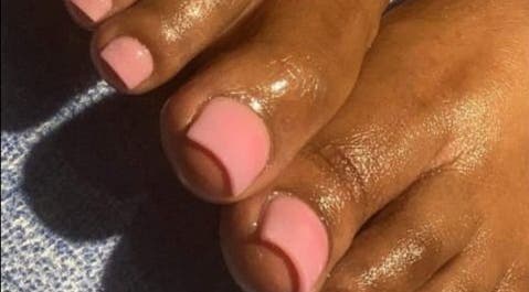 Elegant pink pedicure from Palace Nails in Bowling Green, Kentucky, US, highlighting shiny, well-groomed toes.