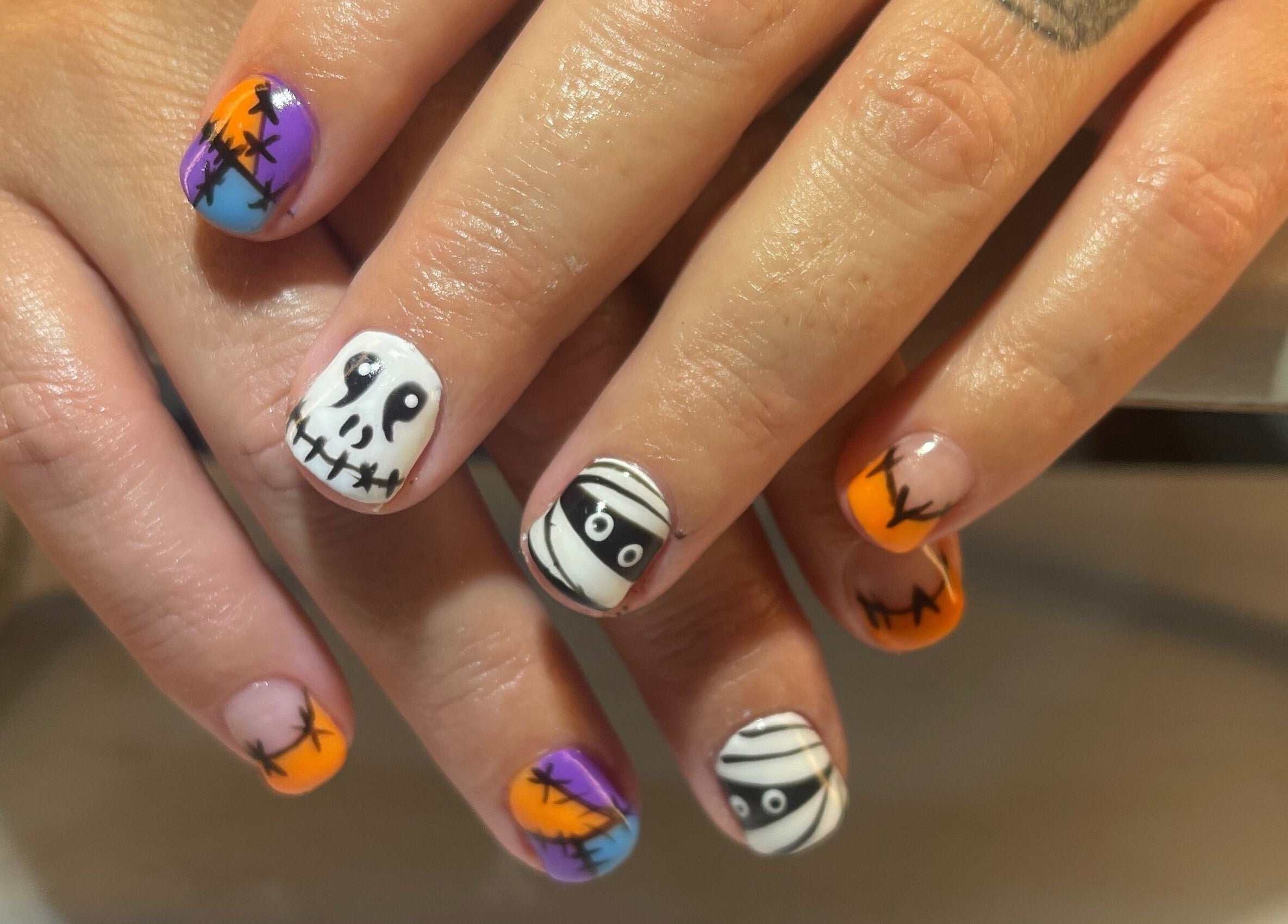 Creative Halloween-themed nail art at Palace Nails, Bowling Green, Kentucky, US offering unique designs.