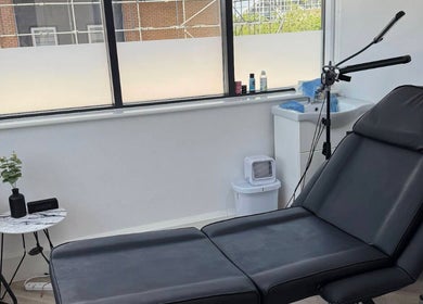 Luxurious treatment room at Feelin Fine UK, Milton Keynes, England, GB with sleek furnishings and natural light.