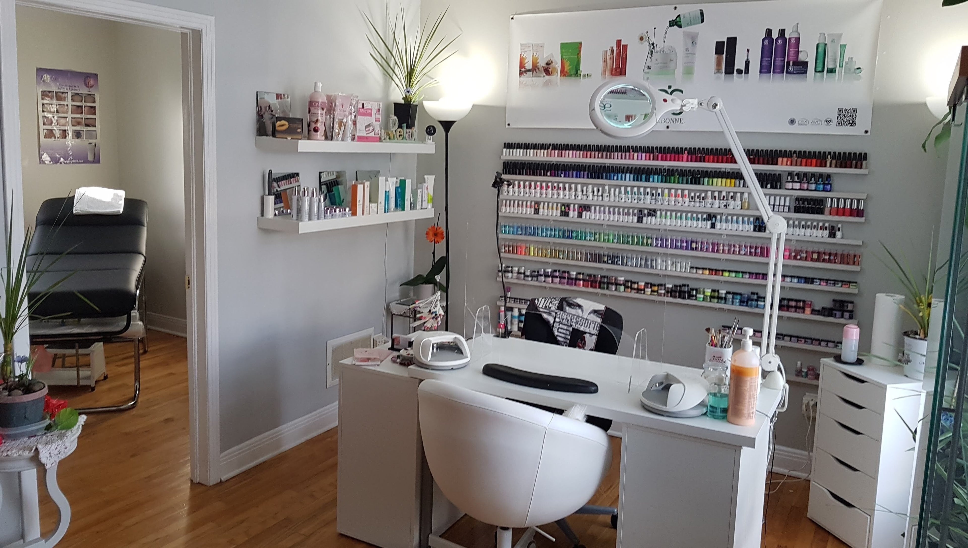 Chic nail salon at T.C. Spa, Ottawa, Ontario, CA, featuring a stylish manicure station with colorful polish display.