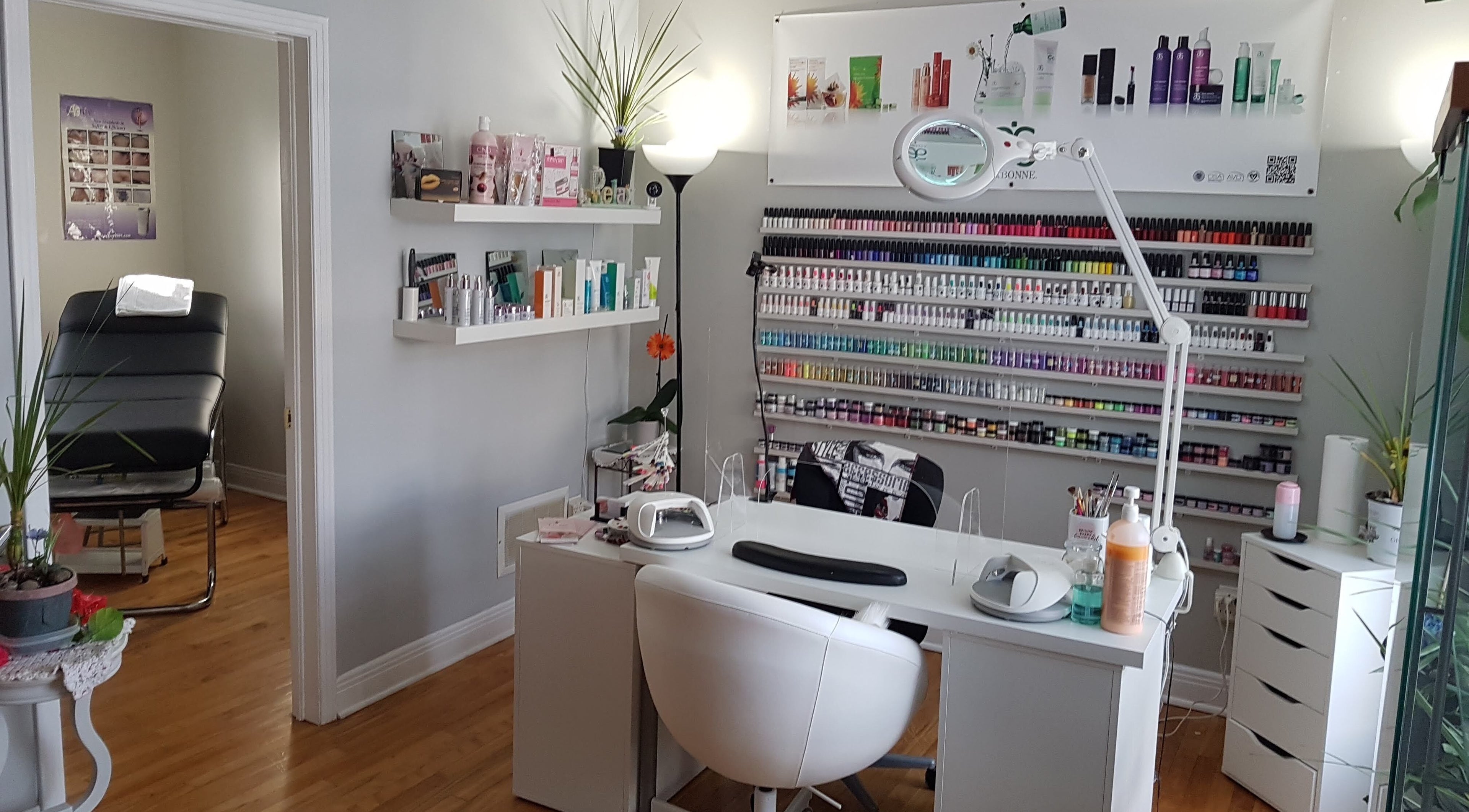 Chic nail salon at T.C. Spa, Ottawa, Ontario, CA, featuring a stylish manicure station with colorful polish display.