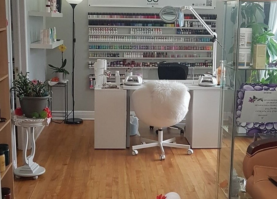 Elegant nail salon setup at T.C. Spa, Ottawa, Ontario, CA. Bright and welcoming with shelves of nail polish.