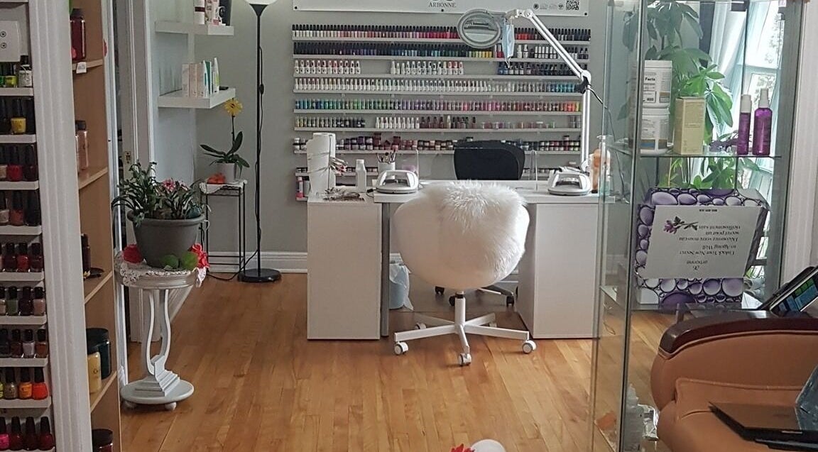 Elegant nail salon setup at T.C. Spa, Ottawa, Ontario, CA. Bright and welcoming with shelves of nail polish.
