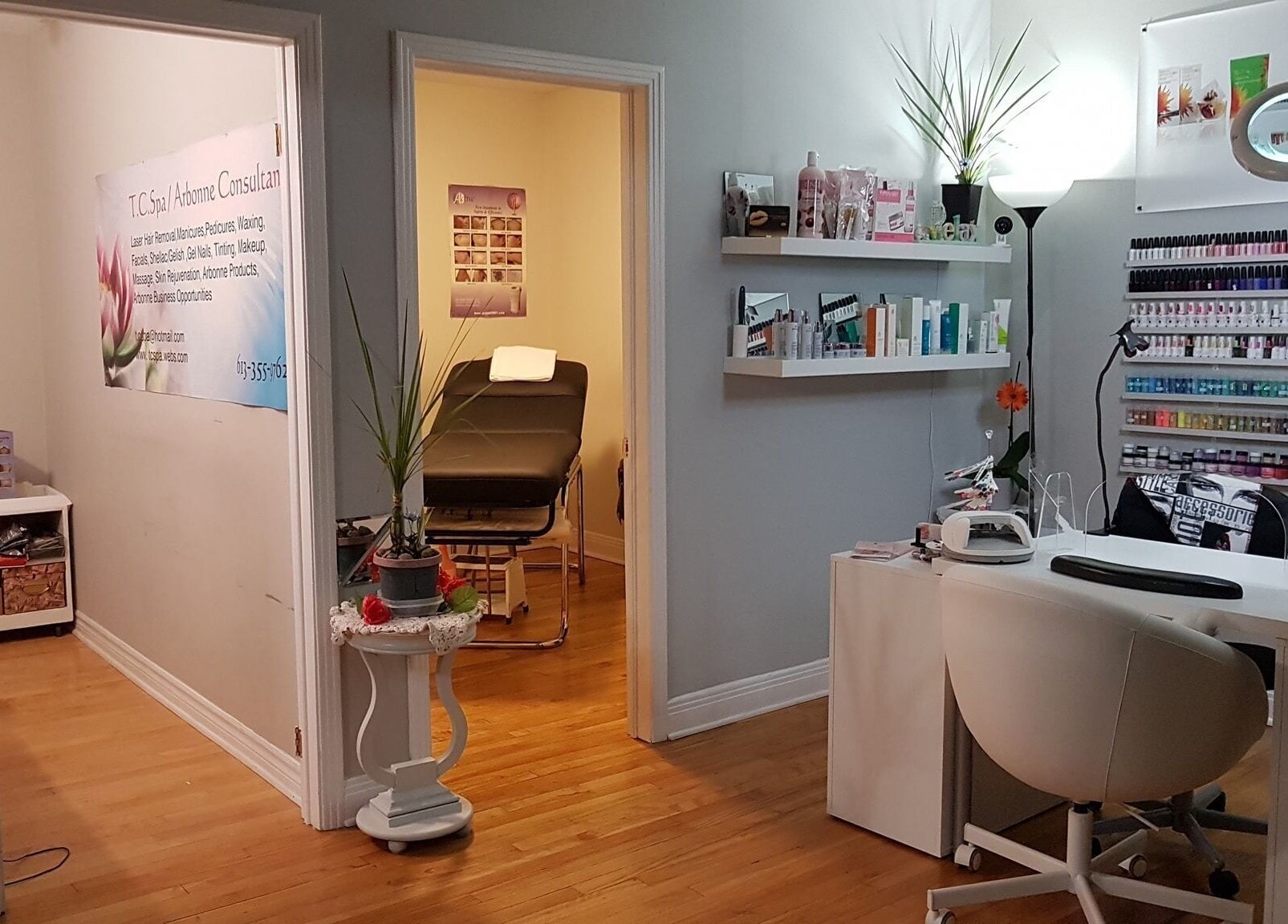 Modern interior of T.C. Spa in Ottawa, Ontario, CA, featuring treatment room and nail polish display.