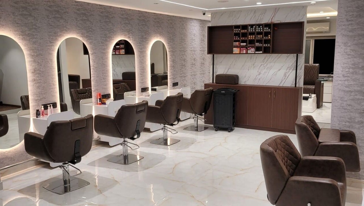 Chic interior of VOX - The Luxury Salon in Hyderabad, Telangana, IN with modern salon chairs and mirrors.