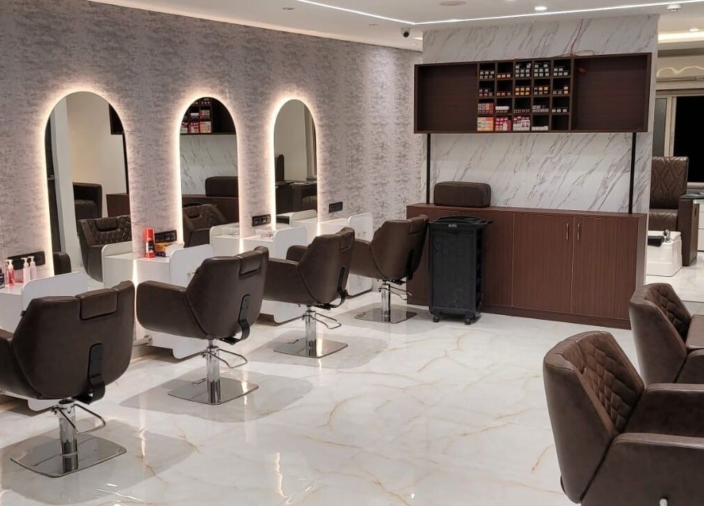 Chic interior of VOX - The Luxury Salon in Hyderabad, Telangana, IN with modern salon chairs and mirrors.