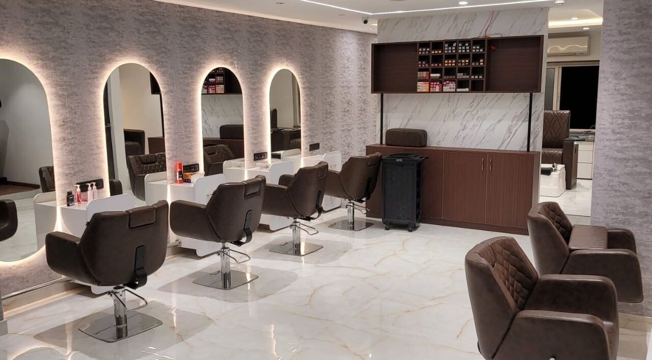 Chic interior of VOX - The Luxury Salon in Hyderabad, Telangana, IN with modern salon chairs and mirrors.