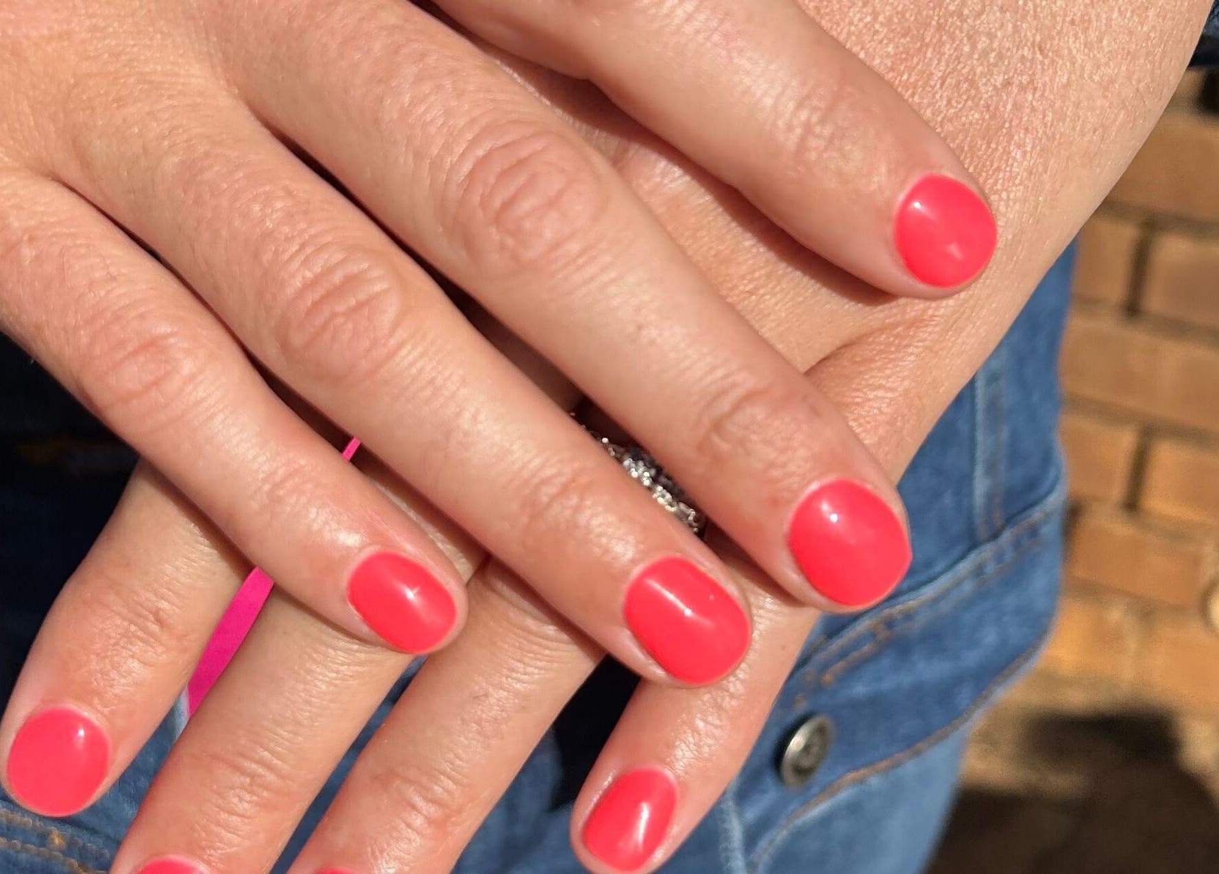 Fresh bright pink manicure at Blooming Nails, Tzaneen, Limpopo, ZA showcasing neat and vibrant nails.
