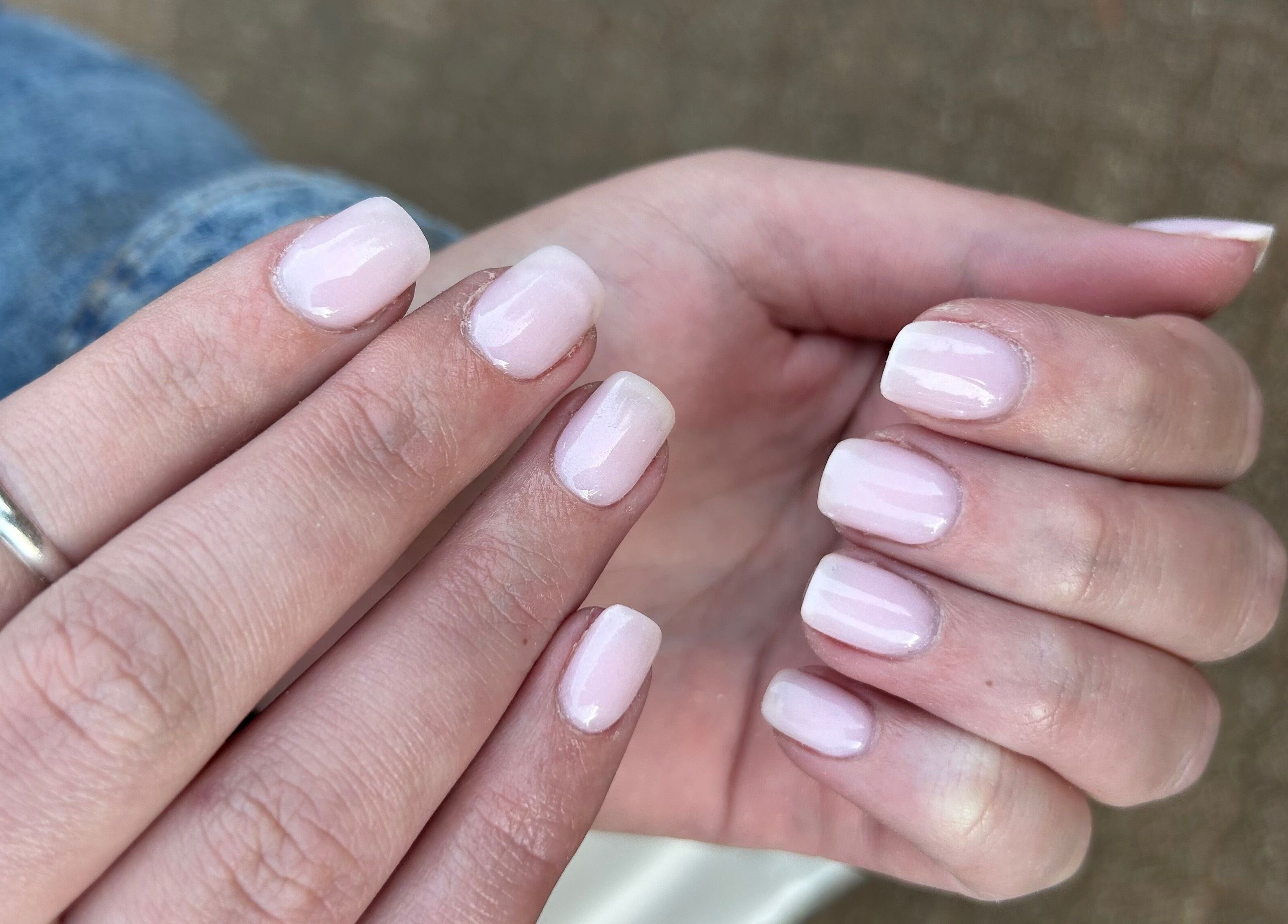 Freshly manicured nails with light pink polish at Blooming Nails, Tzaneen, Limpopo, ZA.