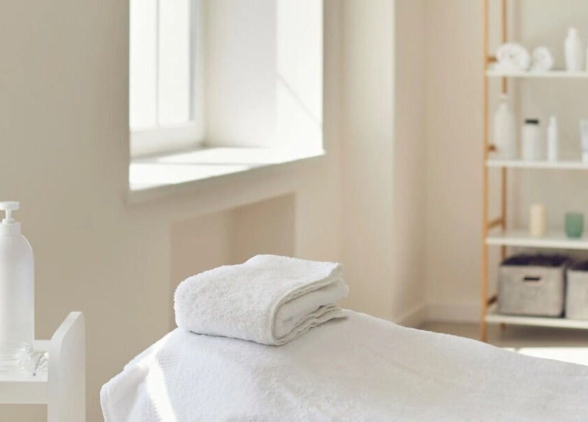 Tranquil therapy room at Rosemount Medical Clinic, Dublin, County Dublin, IE, with soft lighting and towels.