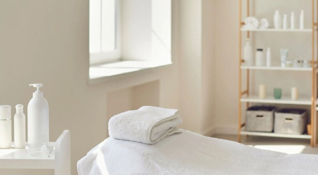 Tranquil therapy room at Rosemount Medical Clinic, Dublin, County Dublin, IE, with soft lighting and towels.