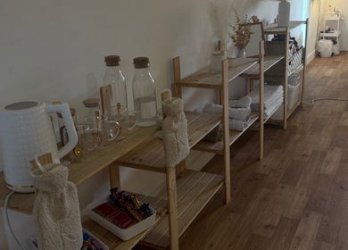 Wooden shelves with glassware and towels at K.C Beauty, Culloden Moor, Scotland, GB enhancing relaxation.