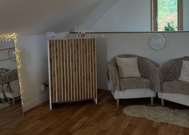 Inviting lounge area with fairy lights at K.C Beauty, Culloden Moor, Scotland, GB.