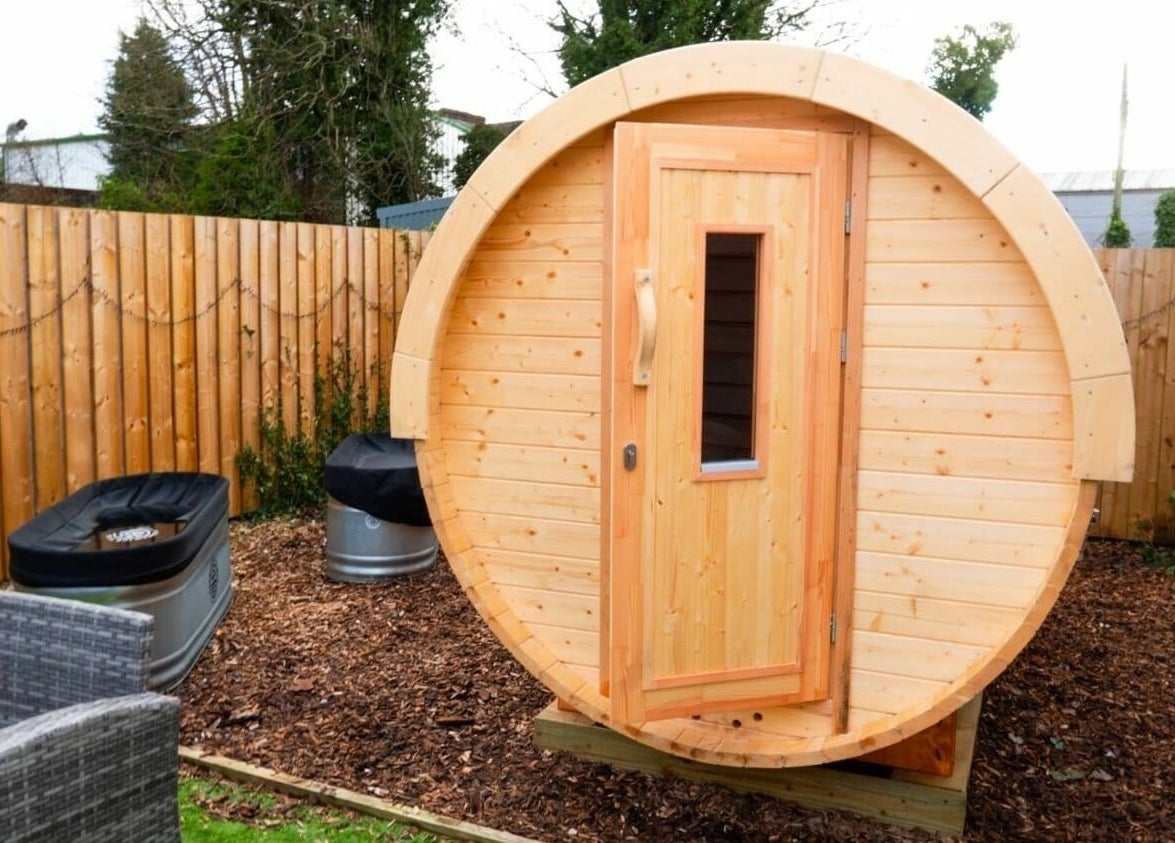 Outdoor barrel sauna at Park West Spa, Hamilton, Scotland, GB, offering a unique wellness experience.