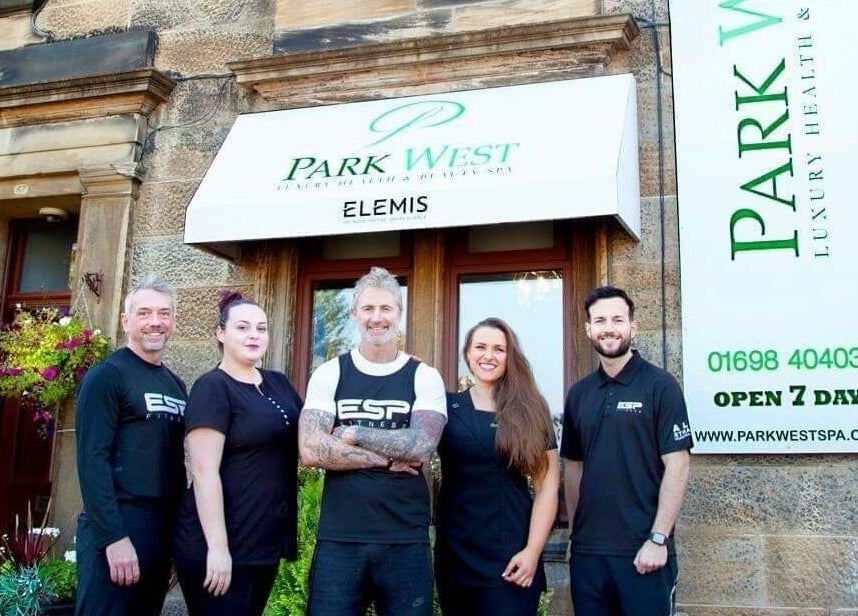 Park West Spa team standing outside the venue in Hamilton, Scotland, GB, welcoming guests with smiles.