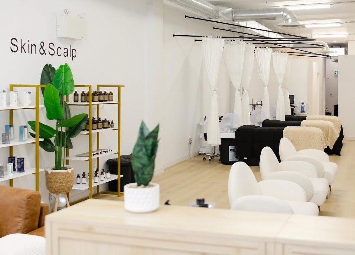 Dilaani Medical Aesthetics & Head Spa in Ottawa, Ontario, CA features stylish treatment chairs and skincare products.