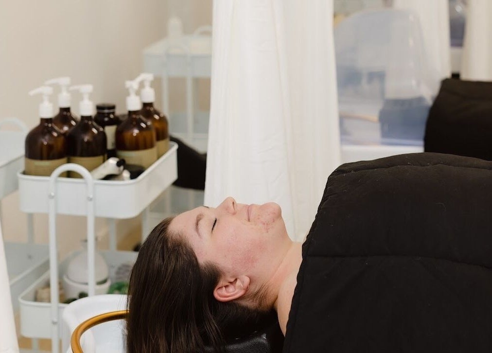 Client enjoying a relaxing treatment at Dilaani Medical Aesthetics & Head Spa, Ottawa, Ontario, CA.