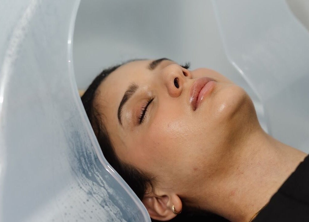Client enjoying a rejuvenating head spa at Dilaani Medical Aesthetics & Head Spa, Ottawa, Ontario, CA.