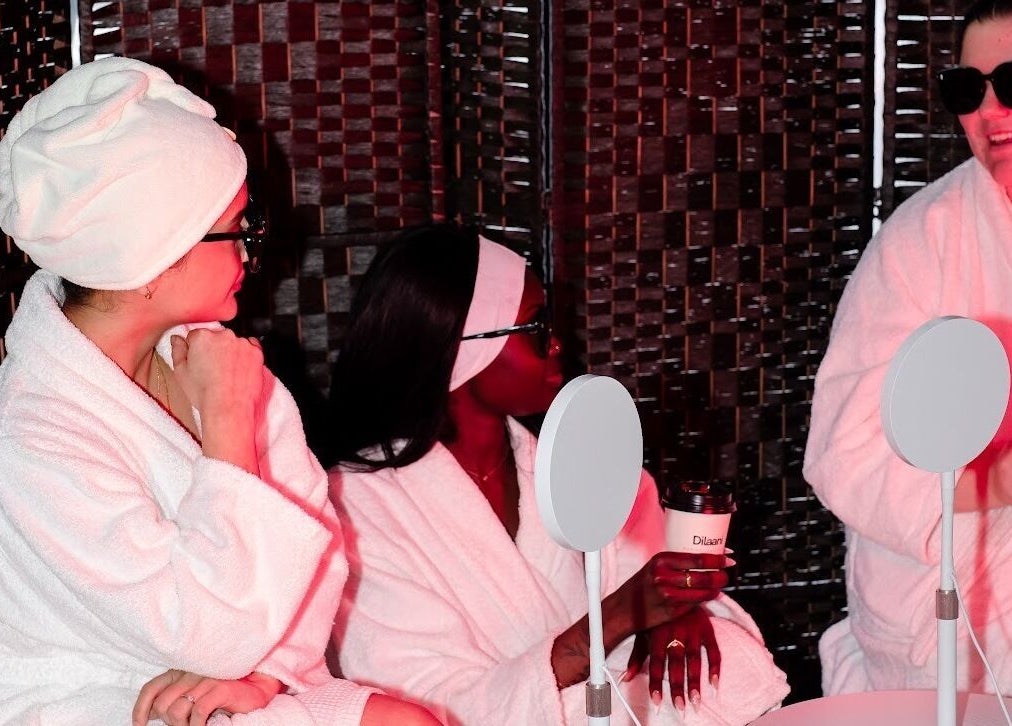 Guests in robes at Dilaani Medical Aesthetics & Head Spa, Ottawa, Ontario, CA enjoying a relaxed conversation.