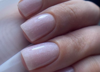 Close-up of glittery nude nails at Nails by Giulia, London, England, GB, showcasing expert nail artistry.