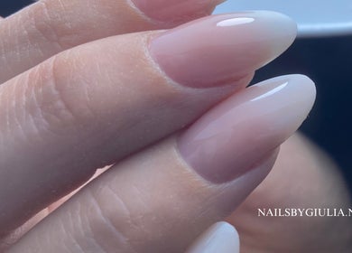 Elegant nude nails manicure at Nails by Giulia, London, England, GB. Perfectly shaped and glossy finish.