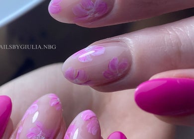 Manicured nails with pink floral design at Nails by Giulia, London, England, GB.