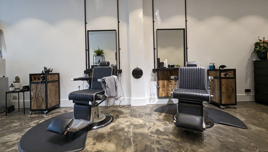 Modern barbershop chairs at BSharp Barbershop, Melbourne, Victoria, AU, offering a stylish grooming experience.