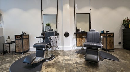 Stylish interior of BSharp Barbershop, Melbourne, Victoria, AU with sleek barber chairs and modern design.