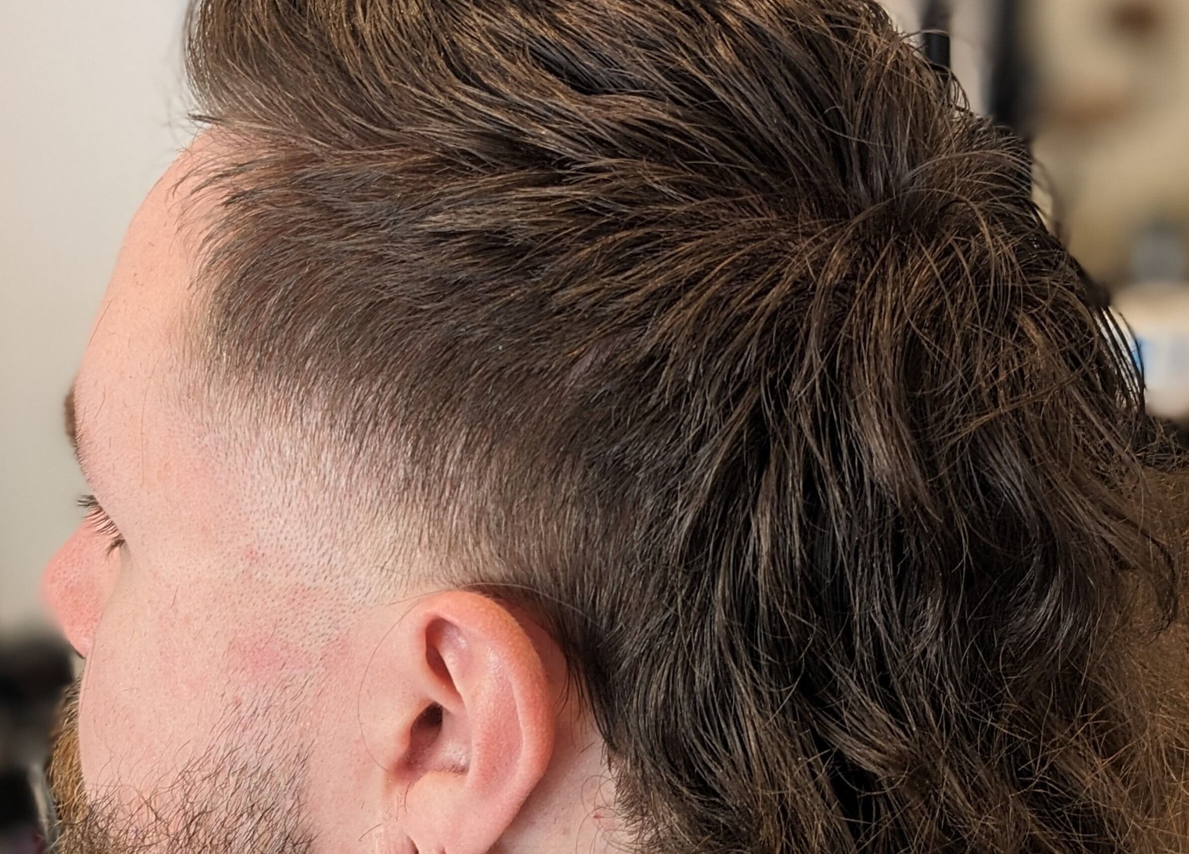 Close-up of a stylish mullet haircut at BSharp Barbershop, Melbourne, Victoria, AU, showcasing expert styling.
