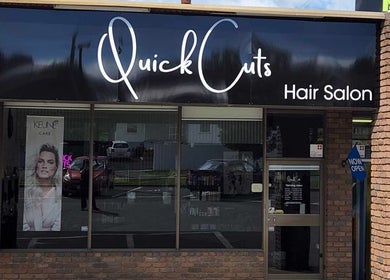 Front view of Quick Cuts hair salon, Prospect, Tasmania, AU with signage and glass windows.