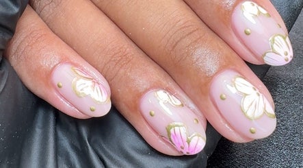 Close-up of pink floral nail art at CE BEAUTY STUDIO, Southampton, England, GB.