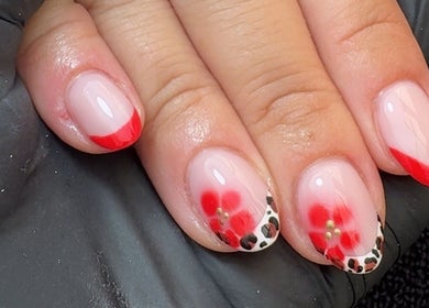 Red and floral nail art at CE BEAUTY STUDIO, Southampton, England, GB. Perfect for a stylish look.
