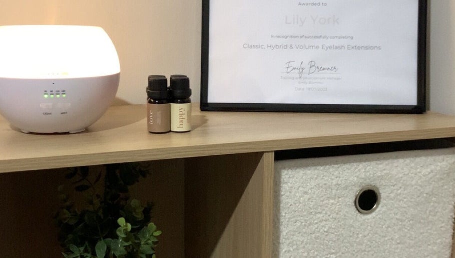 Award certificate and diffuser at Dolled Up By Lily, Kelmscott, Western Australia, AU create a serene atmosphere.
