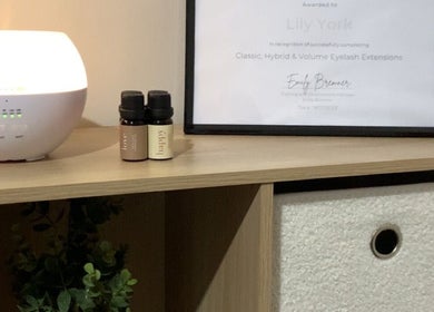 Award certificate and diffuser at Dolled Up By Lily, Kelmscott, Western Australia, AU create a serene atmosphere.
