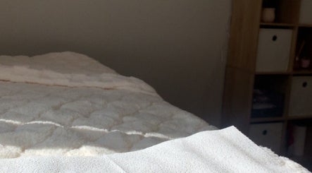 Relaxing treatment bed at Dolled Up By Lily in Kelmscott, Western Australia, AU, inviting a calm wellness experience.