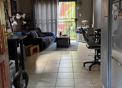 Cutz Hair Crew salon seating area with soft lighting in Randburg, Gauteng, ZA, offering a welcoming ambiance.