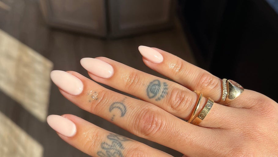 Elegant manicured nails with rings at The Secret Beauty Bar LDN, London, England, GB.