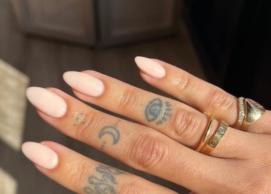 Elegant manicured nails with rings at The Secret Beauty Bar LDN, London, England, GB.
