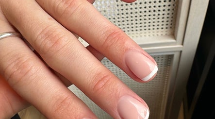 Elegant French manicure at The Secret Beauty Bar LDN in London, England, GB, showcasing perfect nail care.