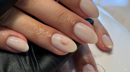 Manicured nails with subtle gold detail at The Secret Beauty Bar LDN, London, England, GB.