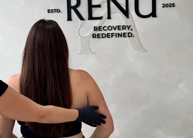 Therapist massaging client at Renū, West Kirby, England, GB for ultimate relaxation and rejuvenation.
