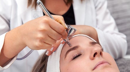 Facial treatment at R&R Skin Care Clinic, Auckland, Auckland, NZ. Close-up of esthetician performing skincare.