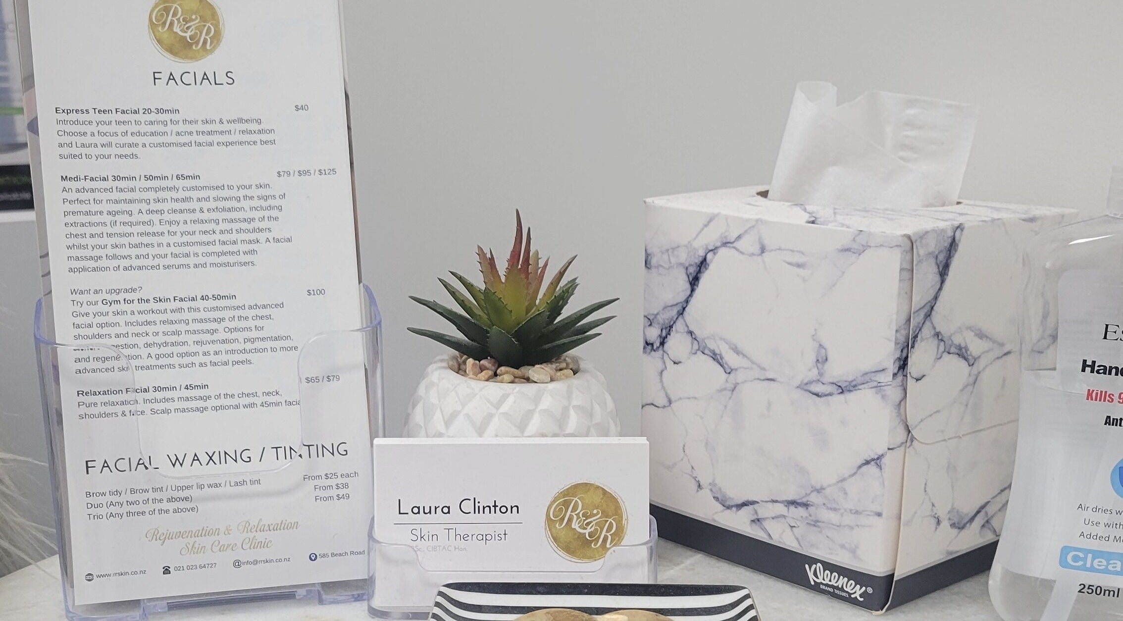 R&R Skin Care Clinic brochure, card, and decor at Auckland, NZ, showcasing facial services and relaxation ambiance.
