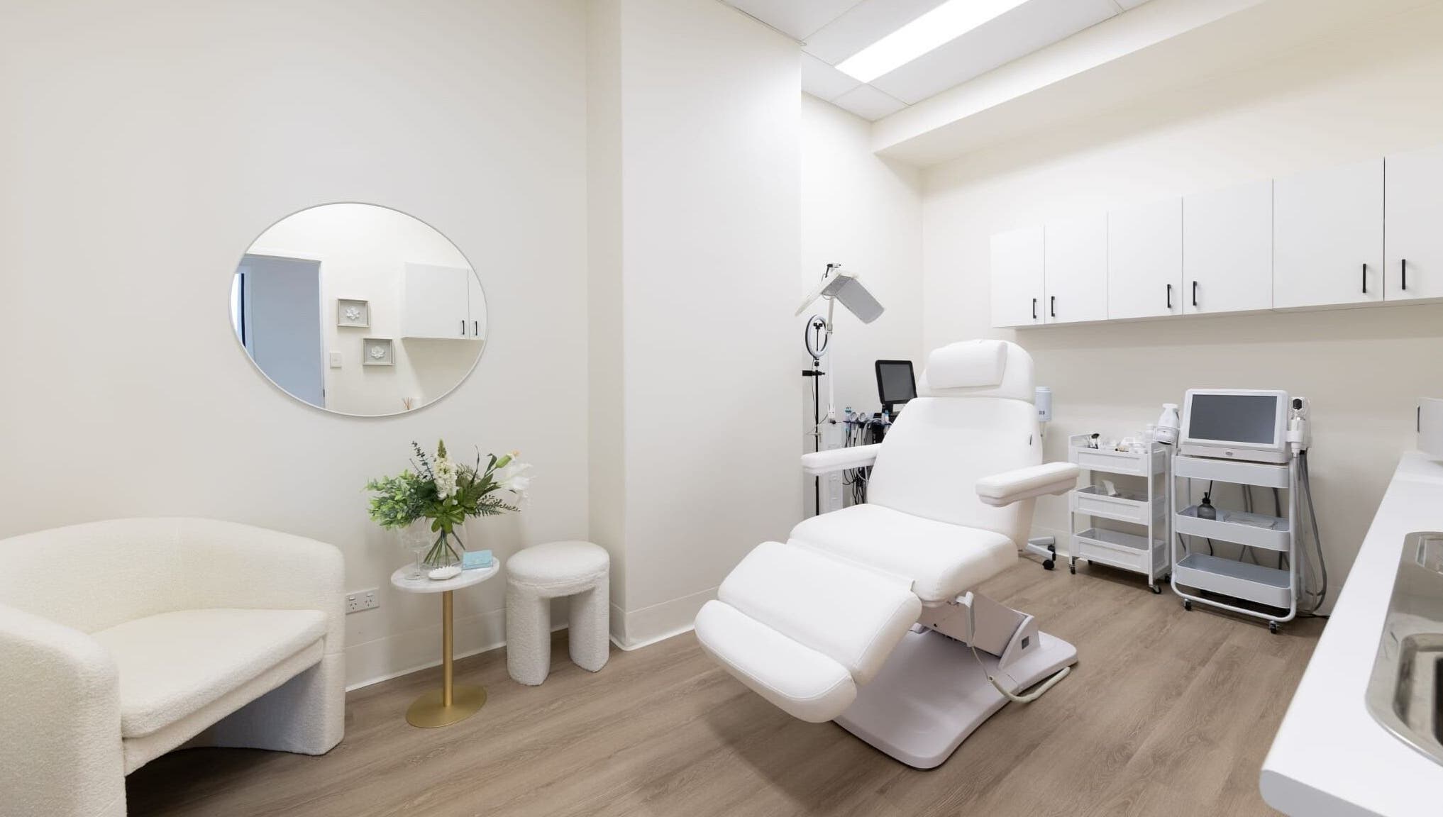 Luxurious treatment room at Lumina Skincare Clinic, Gold Coast, Queensland, AU. Elegant white decor.